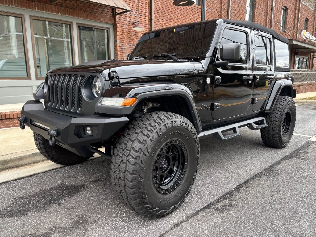 Used 2019 Jeep Wrangler Unlimited Sahara with VIN 1C4HJXEG8KW660382 for sale in Roswell, GA